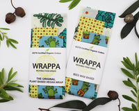 Photo of WRAPPA Wax Wraps with succulent print, on a white background surrounded by native Australian leaves and gum nuts.